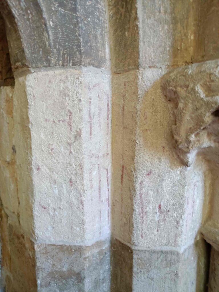 Mediaeval carving and a residue of ancient red paint