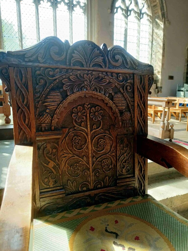 the other beautifully carved chair