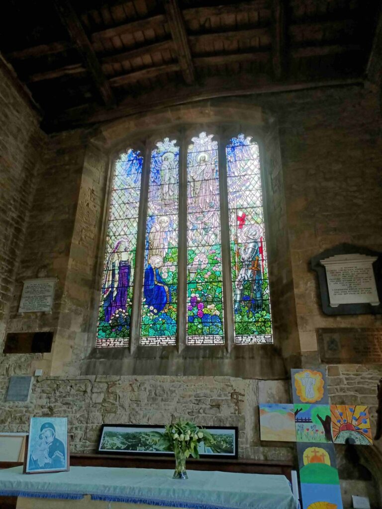 A modern stained glass window in the North Aisle