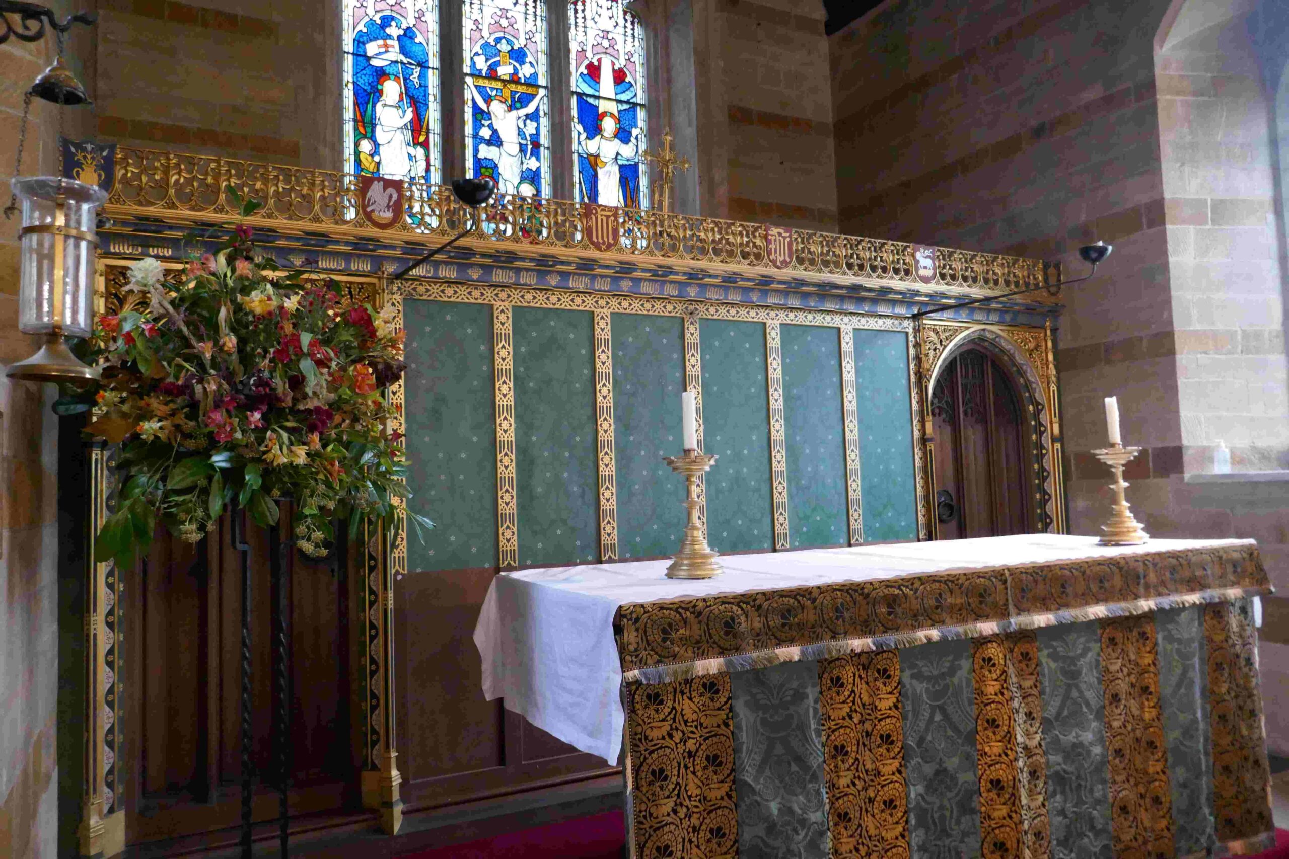 The altar and Reredos, with the sanctuary light