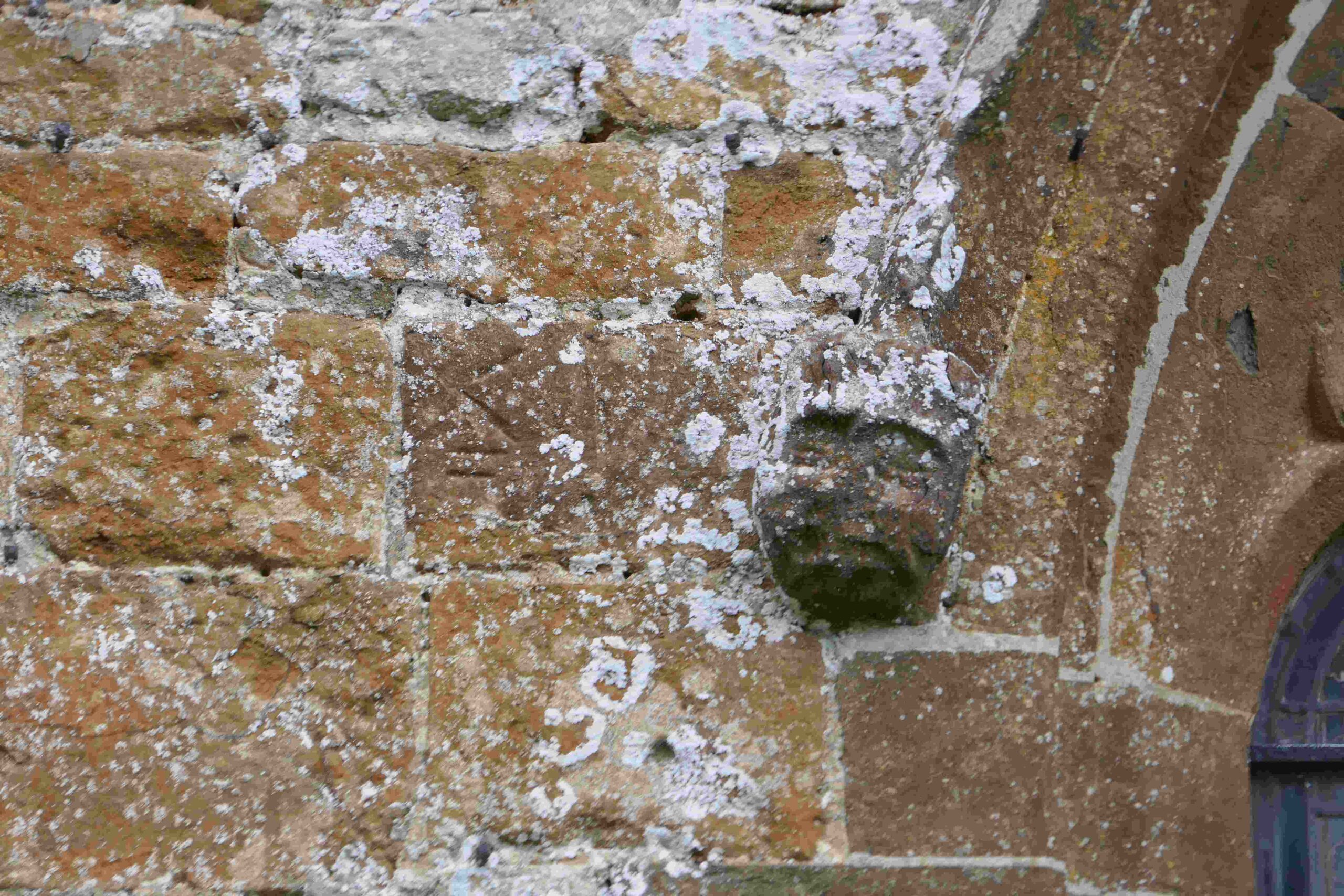 A window boss with the Mason's Mark visible; usually they are hidden in the stonework.