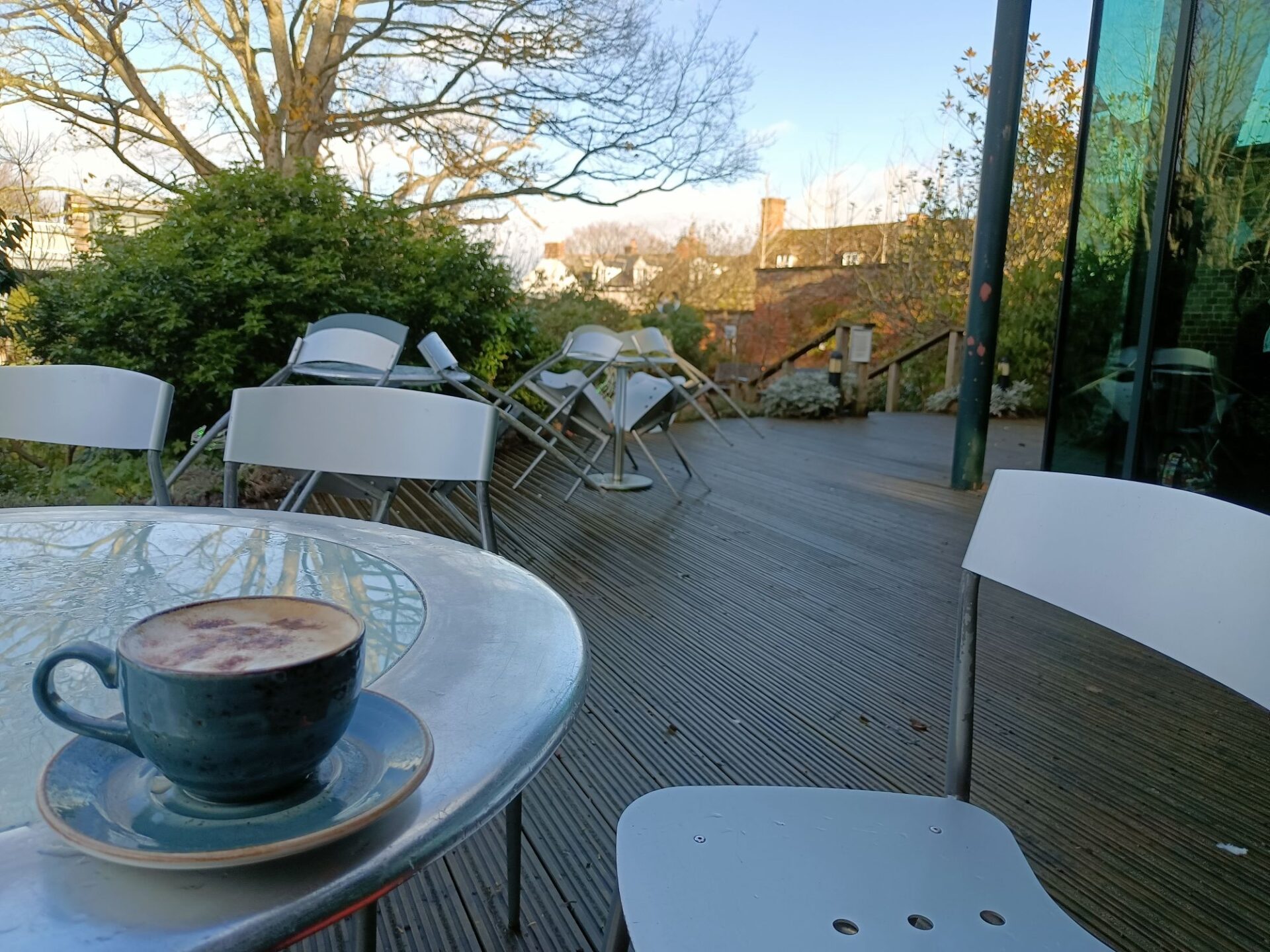 coffee cup on a table on the terrace outside the Museum Cafe