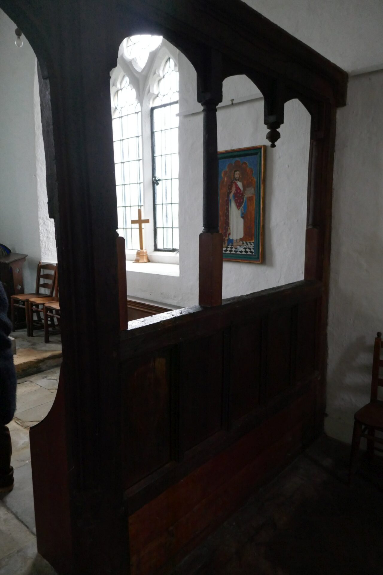 a view of the interior, the oak screen, a window and the only picture - St B himself! on the wall