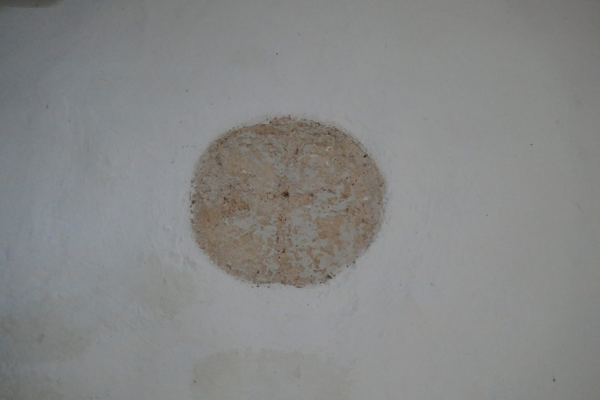 one of the original wall decorations, a painted cross faintly visible