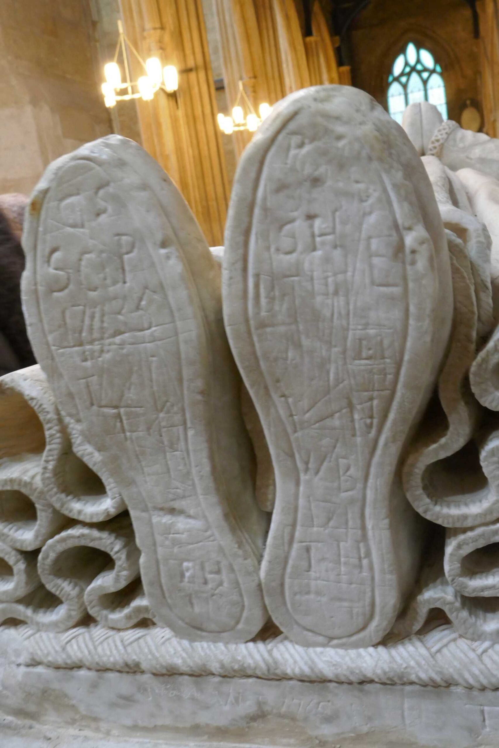 Ancient Grafitti on the feet of one of the Memorals