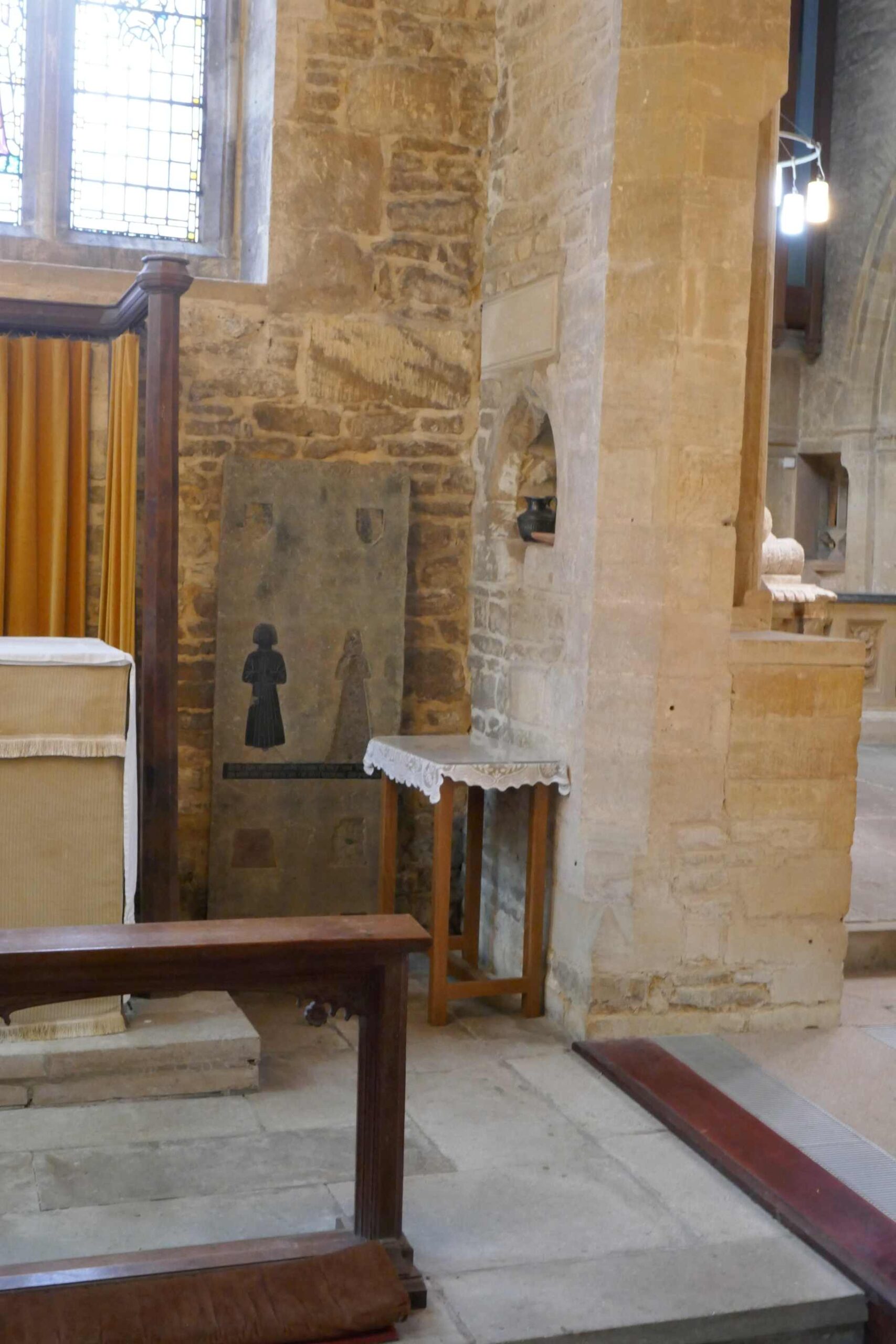 a high level lavabo - the floor level must have been lowered! and a slab with some brasses on it